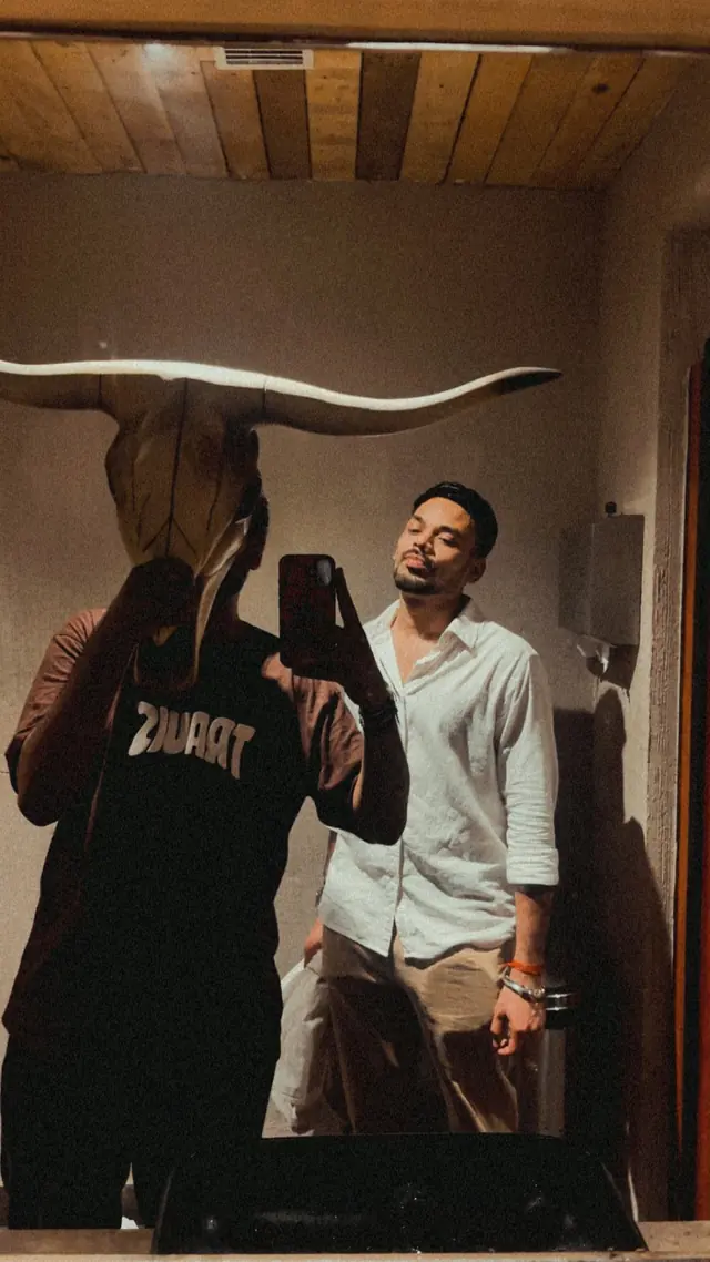 Aman taking a mirror photograph